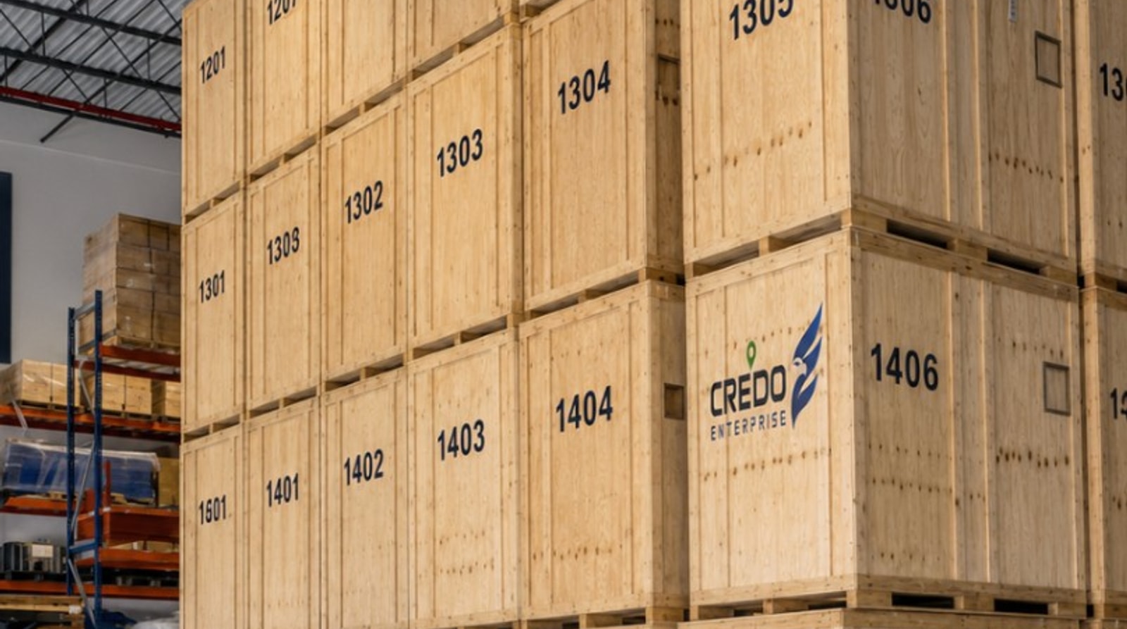 Credo Enterprise climate-controlled warehouse with branded wooden storage vaults stacked floor to ceiling